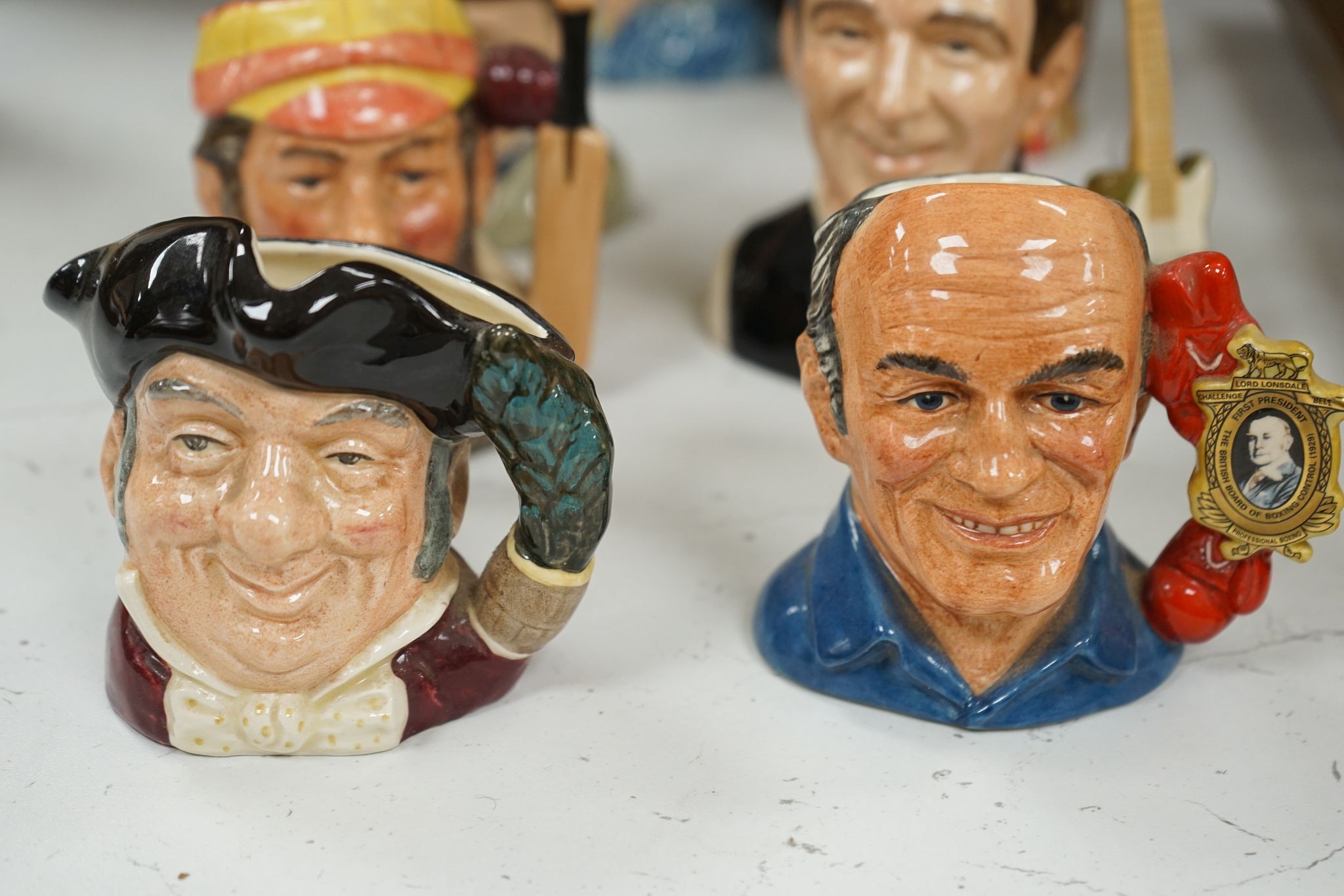 A collection of Royal Doulton character jugs, most boxed